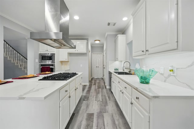 2003 Birnam Wood Dr, Sugar Land, TX 77479 - kitchen with stainless steel appliances, island exhaust hood, crown molding, a sink, and white cabinets