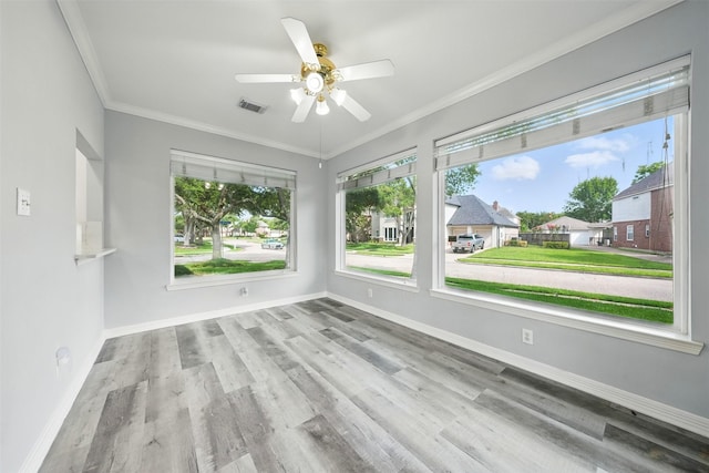 2003 Birnam Wood Dr, Sugar Land, TX 77479 - spare room with a ceiling fan, baseboards, wood finished floors, and crown molding