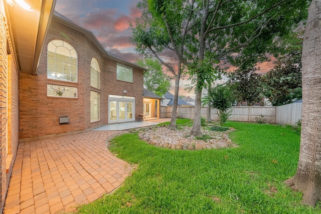 2003 Birnam Wood Dr, Sugar Land, TX 77479 - view of yard featuring french doors and a patio