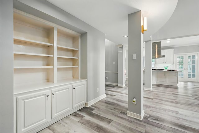 2003 Birnam Wood Dr, Sugar Land, TX 77479 - interior space featuring light wood finished floors, french doors, baseboards, and recessed lighting