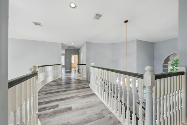 2003 Birnam Wood Dr, Sugar Land, TX 77479 - corridor with an upstairs landing, healthy amount of natural light, wood finished floors, and recessed lighting