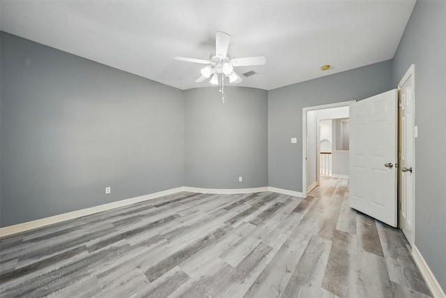 2003 Birnam Wood Dr, Sugar Land, TX 77479 - spare room featuring light wood-type flooring, ceiling fan, and baseboards