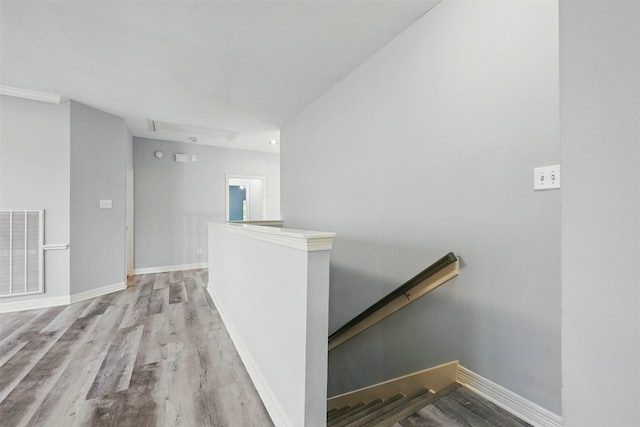 2003 Birnam Wood Dr, Sugar Land, TX 77479 - corridor featuring an upstairs landing, attic access, wood finished floors, and baseboards