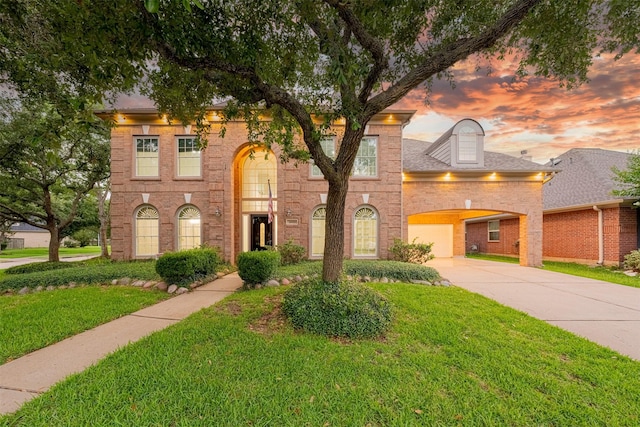 2003 Birnam Wood Dr, Sugar Land, TX 77479 - view of front of house featuring driveway, a yard, and brick siding