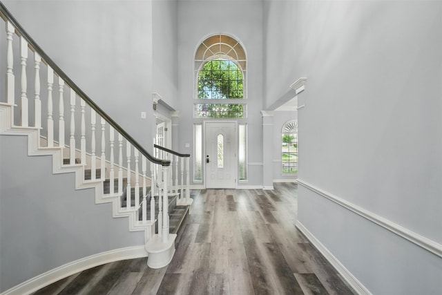 2003 Birnam Wood Dr, Sugar Land, TX 77479 - entryway with a towering ceiling, wood finished floors, stairway, plenty of natural light, and baseboards
