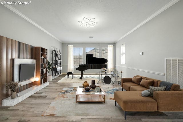 2003 Birnam Wood Dr, Sugar Land, TX 77479 - living room featuring wood finished floors, crown molding, and baseboards