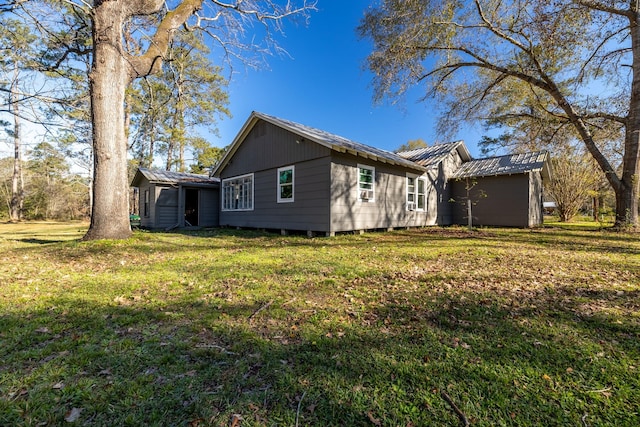 2175 Fm 1725th Rd, Cleveland, TX 77328 - view of side of home featuring metal roof and a lawn