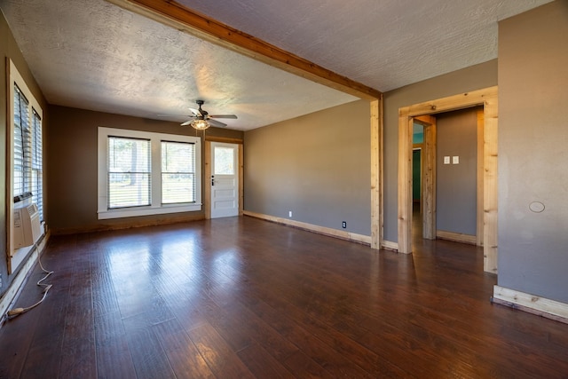 2175 Fm 1725th Rd, Cleveland, TX 77328 - empty room featuring a ceiling fan, dark wood-style flooring, baseboards, and a textured ceiling