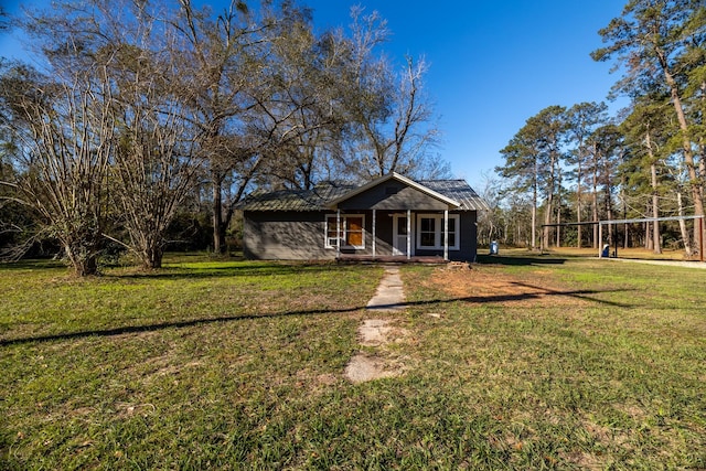 2175 Fm 1725th Rd, Cleveland, TX 77328 - view of front facade with covered porch and a front lawn