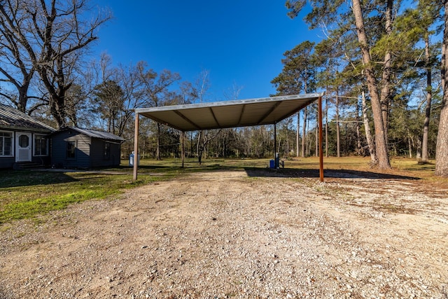 2175 Fm 1725th Rd, Cleveland, TX 77328 - view of grassy yard featuring a carport and driveway