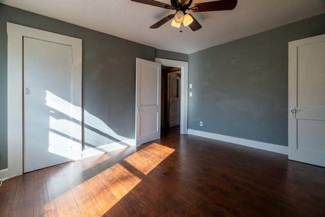 2175 Fm 1725th Rd, Cleveland, TX 77328 - unfurnished bedroom with dark wood-type flooring, baseboards, and a ceiling fan