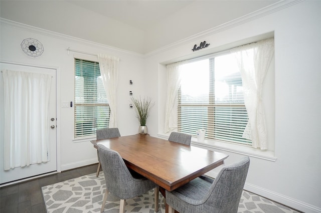 18711 Big Elm Dr, Cypress, TX 77433 - dining space featuring healthy amount of natural light, baseboards, ornamental molding, and wood finished floors