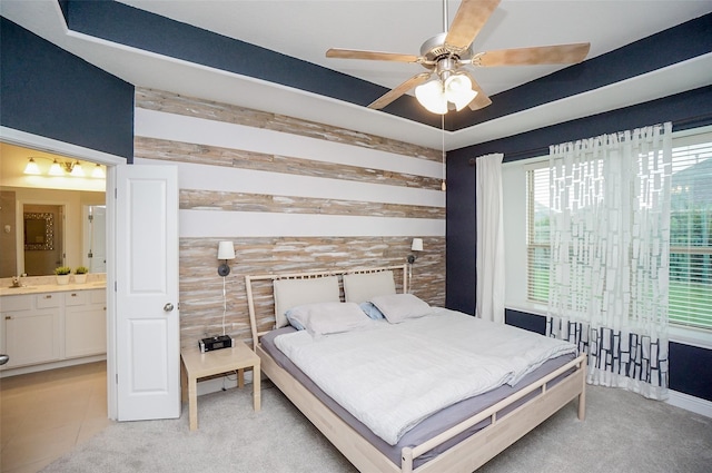 18711 Big Elm Dr, Cypress, TX 77433 - bedroom with a sink, ensuite bathroom, light colored carpet, and ceiling fan