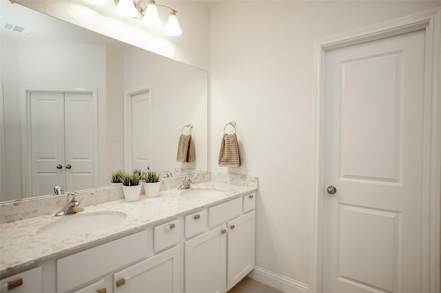 18711 Big Elm Dr, Cypress, TX 77433 - full bathroom with double vanity and baseboards