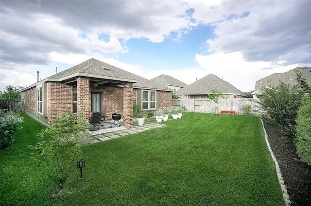 18711 Big Elm Dr, Cypress, TX 77433 - rear view of property featuring brick siding, a patio, and roof with shingles