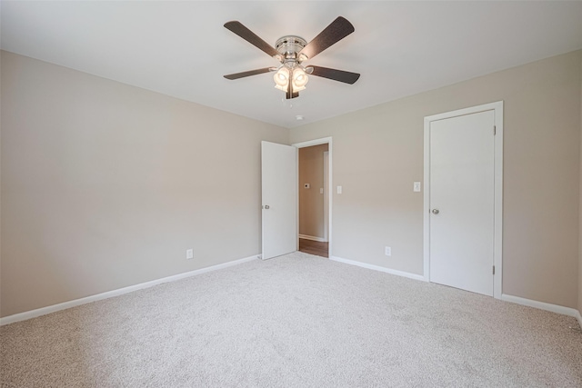 1316 Courtney St, Richmond, TX 77469 - unfurnished bedroom featuring light carpet, baseboards, and a ceiling fan