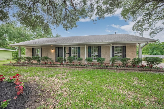1316 Courtney St, Richmond, TX 77469 - ranch-style house featuring a front lawn, brick siding, and covered porch