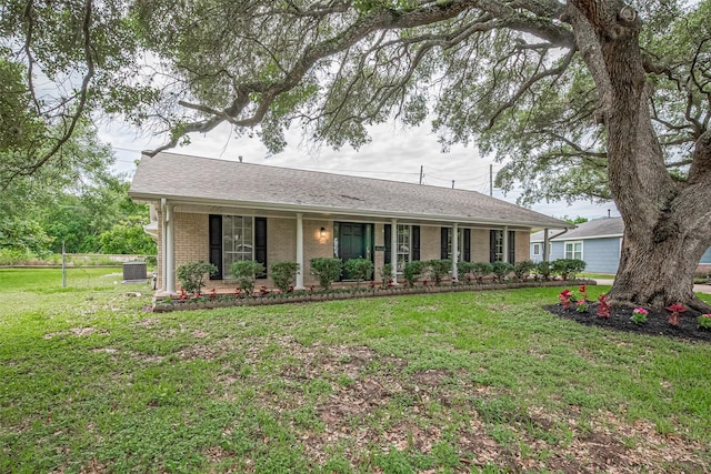 1316 Courtney St, Richmond, TX 77469 - single story home featuring a porch, a front lawn, central AC unit, and brick siding
