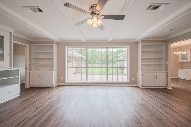 1316 Courtney St, Richmond, TX 77469 - unfurnished living room featuring wood finished floors, baseboards, a chandelier, beamed ceiling, and ornamental molding