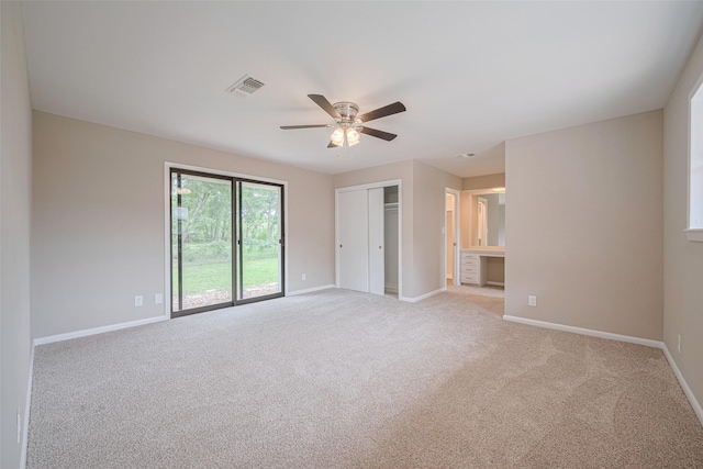 1316 Courtney St, Richmond, TX 77469 - unfurnished bedroom with baseboards, light carpet, ceiling fan, and a closet