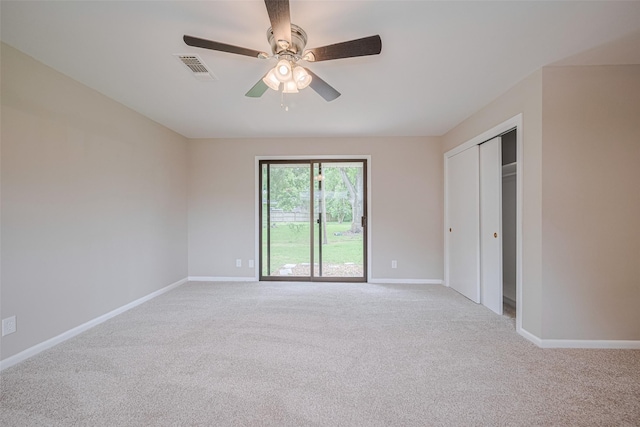 1316 Courtney St, Richmond, TX 77469 - unfurnished bedroom with light colored carpet, baseboards, a closet, and a ceiling fan