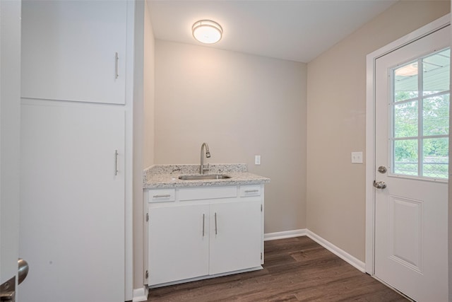 1316 Courtney St, Richmond, TX 77469 - washroom featuring a sink, dark wood-style floors, and baseboards