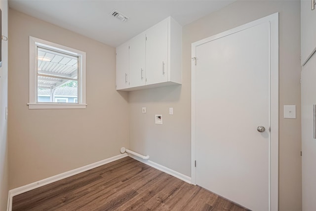 1316 Courtney St, Richmond, TX 77469 - laundry room featuring wood finished floors, cabinet space, baseboards, and washer hookup