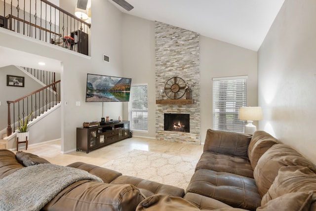 4 Hickory Oak Dr, Spring, TX 77381 - living room with high vaulted ceiling, plenty of natural light, stairway, a fireplace, and baseboards