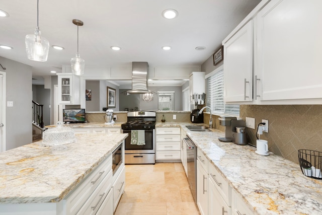 4 Hickory Oak Dr, Spring, TX 77381 - kitchen with appliances with stainless steel finishes, a sink, island range hood, recessed lighting, and backsplash