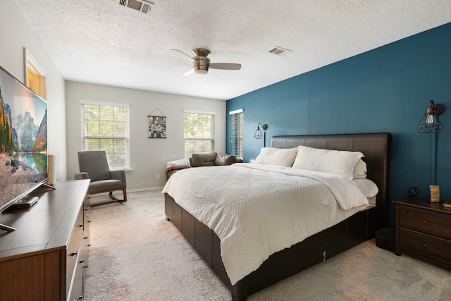4 Hickory Oak Dr, Spring, TX 77381 - carpeted bedroom with a textured ceiling and ceiling fan