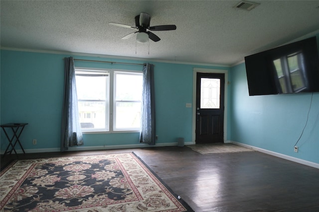 10912 Fm 523rd Rd, Angleton, TX 77515 - entryway with a textured ceiling, wood finished floors, a ceiling fan, ornamental molding, and baseboards