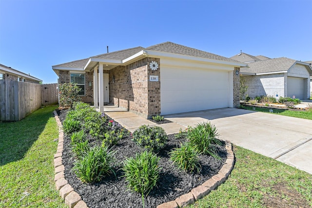 138 Austin Rd, Angleton, TX 77515 - single story home with brick siding, a garage, and concrete driveway
