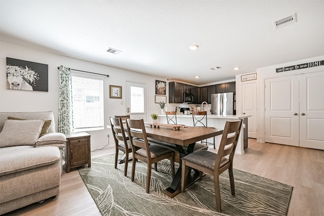 138 Austin Rd, Angleton, TX 77515 - dining space featuring light wood-type flooring and recessed lighting