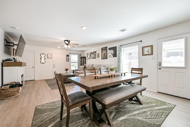 138 Austin Rd, Angleton, TX 77515 - dining area featuring light wood-style floors, a ceiling fan, and baseboards
