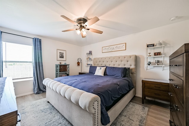 138 Austin Rd, Angleton, TX 77515 - bedroom with wood finished floors, baseboards, and a ceiling fan