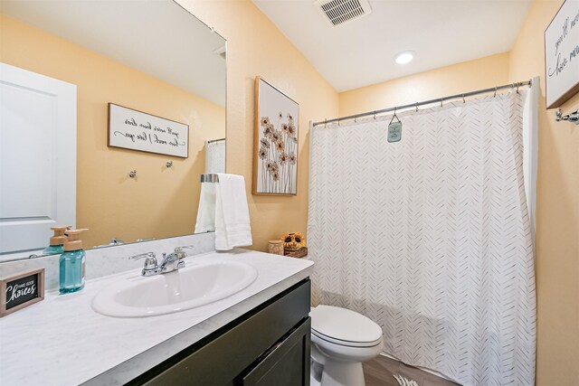 138 Austin Rd, Angleton, TX 77515 - bathroom with vanity, toilet, and a shower with curtain