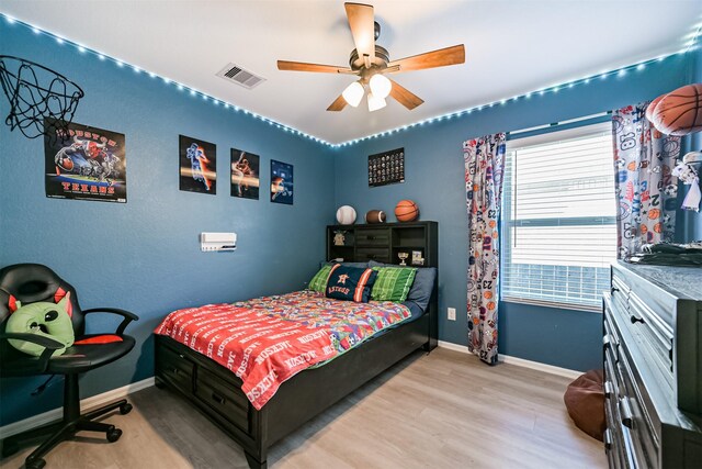 138 Austin Rd, Angleton, TX 77515 - bedroom with wood finished floors, baseboards, and ceiling fan