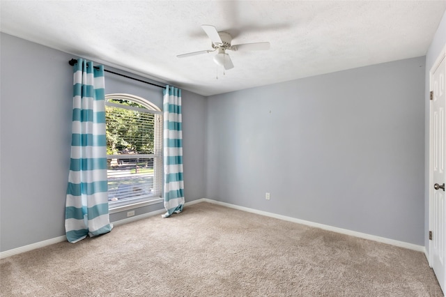 3911 Misty Gardens Ct, Kingwood, TX 77339 - carpeted empty room featuring a ceiling fan, baseboards, and a textured ceiling