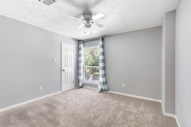 3911 Misty Gardens Ct, Kingwood, TX 77339 - empty room featuring ceiling fan, a textured ceiling, carpet, and baseboards