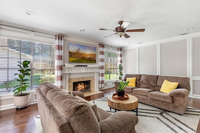 3911 Misty Gardens Ct, Kingwood, TX 77339 - living area featuring dark wood-style floors, ceiling fan, a fireplace with flush hearth, and recessed lighting