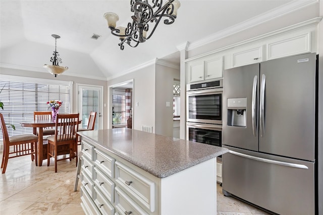 3911 Misty Gardens Ct, Kingwood, TX 77339 - kitchen with stainless steel appliances, crown molding, lofted ceiling, a chandelier, and white cabinets