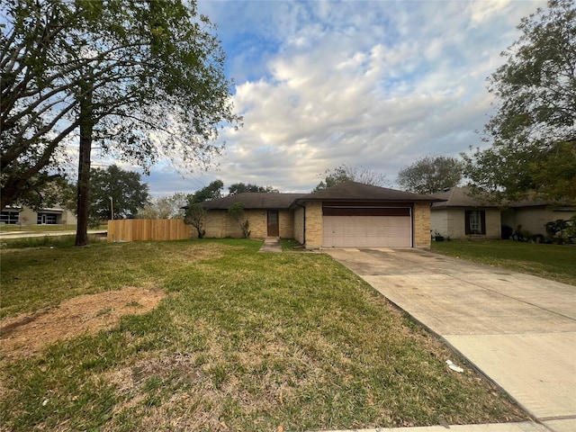 15938 Rosebriar Dr, Houston, TX 77489 - view of front of house featuring an attached garage, brick siding, and driveway
