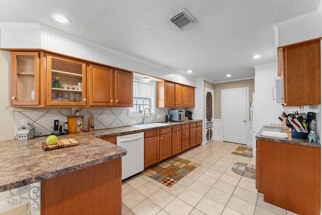 23826 Farm Hill Rd, Spring, TX 77373 - kitchen featuring white appliances, a sink, crown molding, brown cabinets, and decorative backsplash
