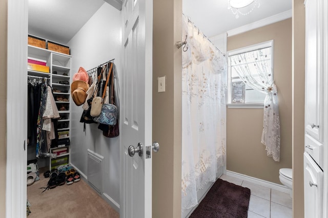 23826 Farm Hill Rd, Spring, TX 77373 - walk in closet featuring tile patterned flooring