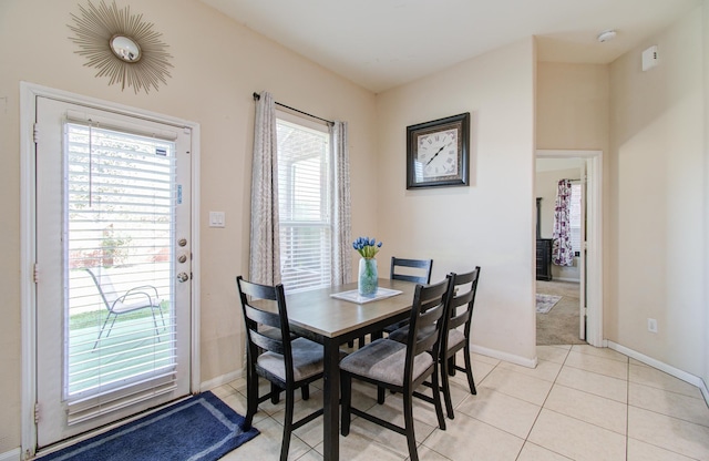 4419 Rolling Field Ln, Sugar Land, TX 77479 - dining room featuring plenty of natural light, baseboards, and light tile patterned flooring