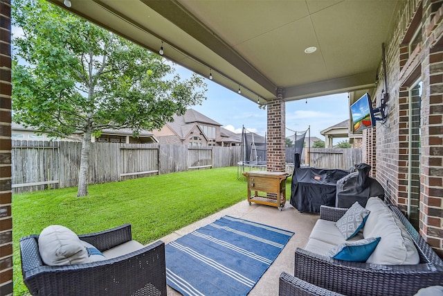 4011 Teramo Ln, Katy, TX 77493 - view of patio / terrace with a trampoline and outdoor lounge area