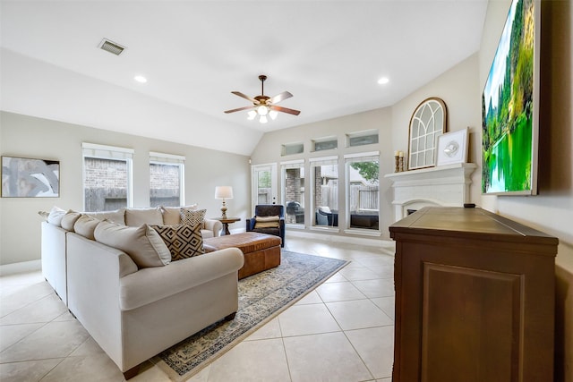 4011 Teramo Ln, Katy, TX 77493 - living room featuring ceiling fan, plenty of natural light, light tile patterned floors, a fireplace, and lofted ceiling