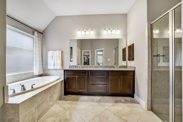 4011 Teramo Ln, Katy, TX 77493 - bathroom with a stall shower, a bath, double vanity, lofted ceiling, and a walk in closet