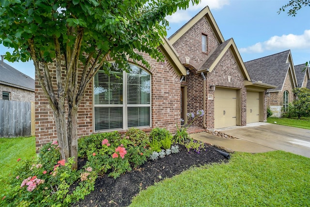 4011 Teramo Ln, Katy, TX 77493 - view of front facade with brick siding, an attached garage, driveway, and a shingled roof