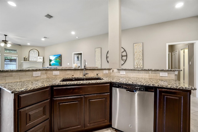 4011 Teramo Ln, Katy, TX 77493 - kitchen featuring dishwasher, a sink, ceiling fan, light stone counters, and dark brown cabinetry